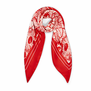 A wrapped red and white silk scarf, photographed against a white background.